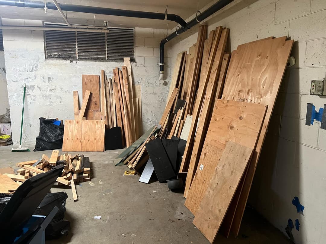 garage full of junk including large wood