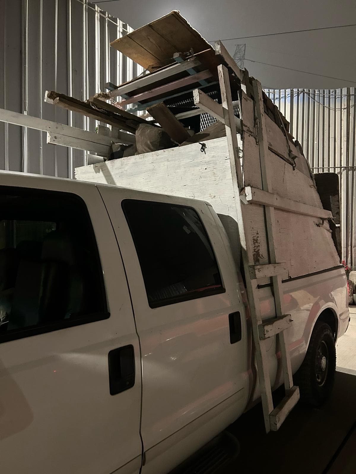 Picture of a work truck full of junk